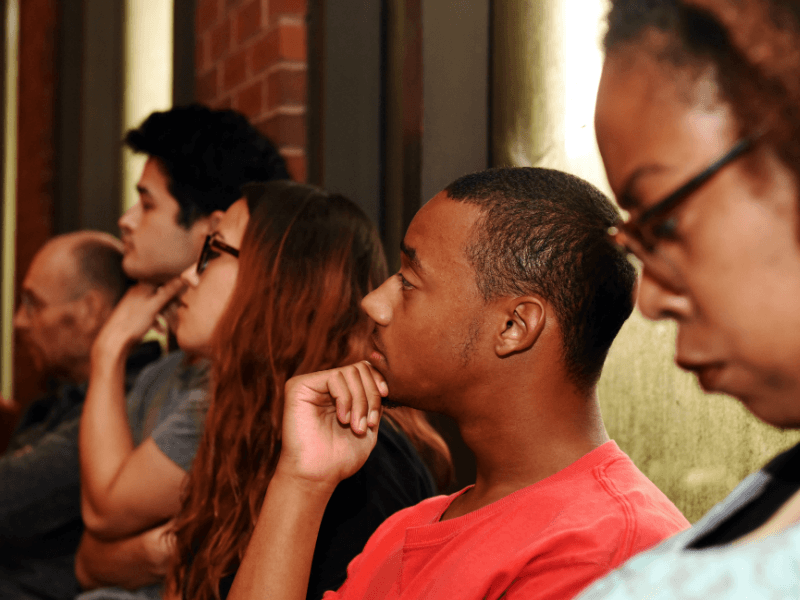A group listens to a lecture A group listens to a lecture