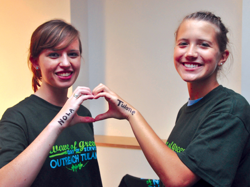 A pair of students creates a heart with their hands, representing Tulane's love of New Orleans A pair of students creates a heart with their hands, representing Tulane's love of New Orleans