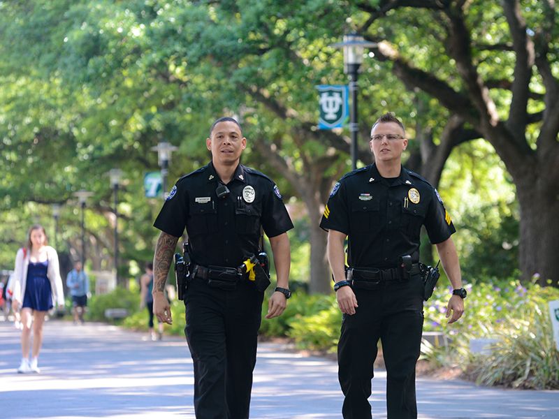 Tulane police officers walk down McAlister Place Tulane police officers walk down McAlister Place