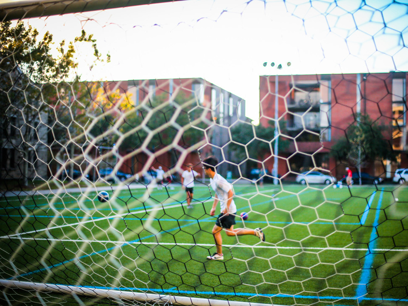 Students play soccer on the quad Students play soccer on campus quad